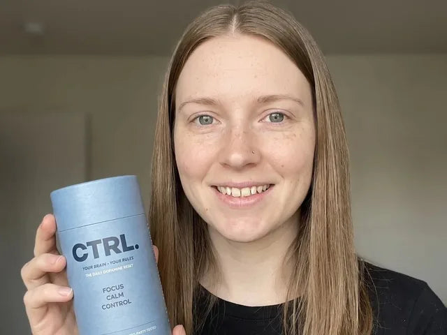Belice C., a verified CTRL customer, holding her CTRL tube