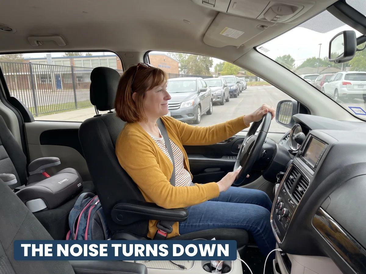 A mum sitting calm and relaxed in her car in the school pickup line