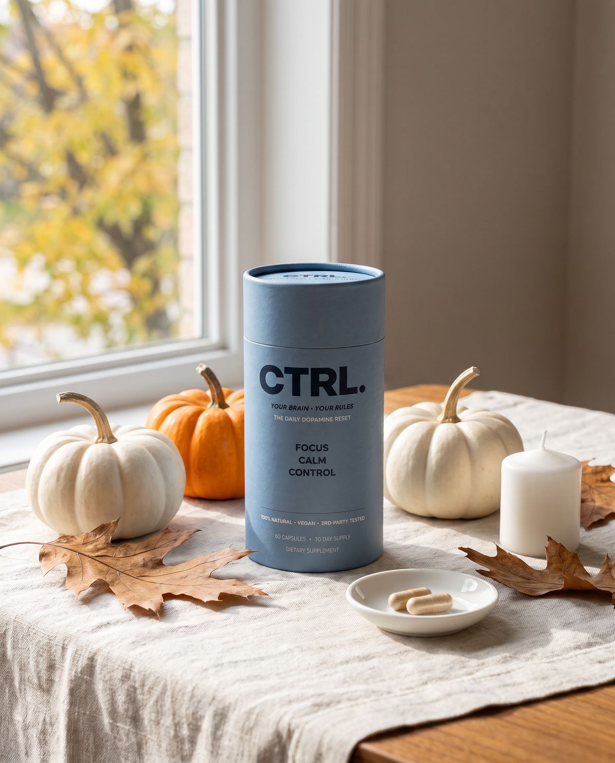 CTRL, the daily dopamine reset, on a table with autumn pumpkins