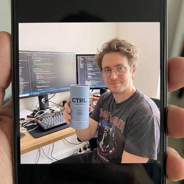 Jordan B., a CTRL customer, holding a CTRL tube