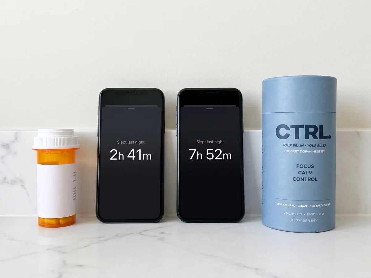 A prescription bottle next to two phones showing 2 hours 41 minutes and 7 hours 52 minutes of sleep, and a CTRL tube