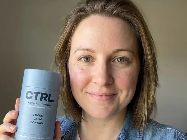 Olivia B., a verified CTRL customer, holding her CTRL tube
