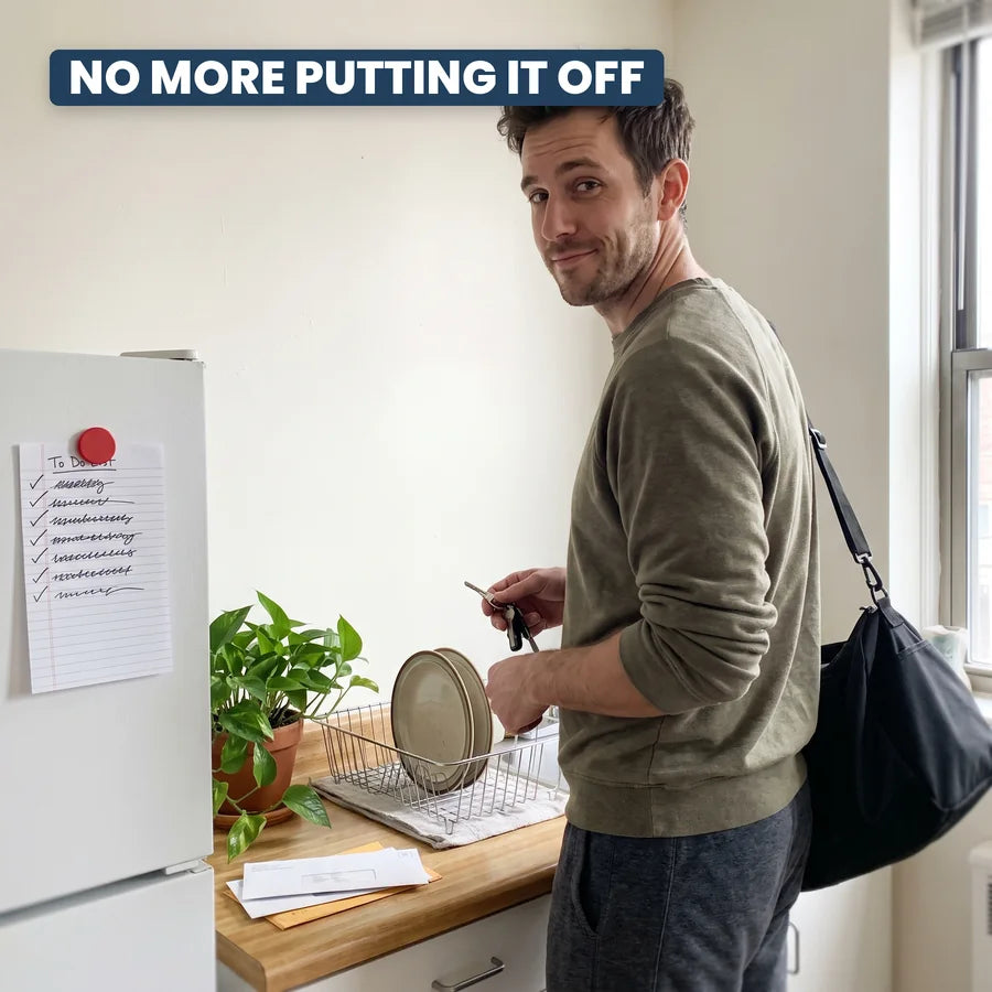 A man heading out with his gym bag past a fridge to-do list with every line ticked off