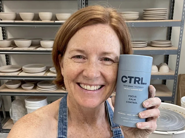 Linda M., a CTRL customer in her fifties, holding her CTRL tube