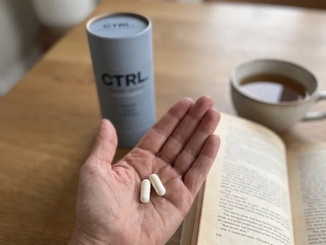 Deborah H., a CTRL customer in her fifties, holding her CTRL tube