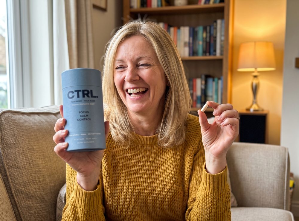 Patricia holding up her CTRL tube and one capsule